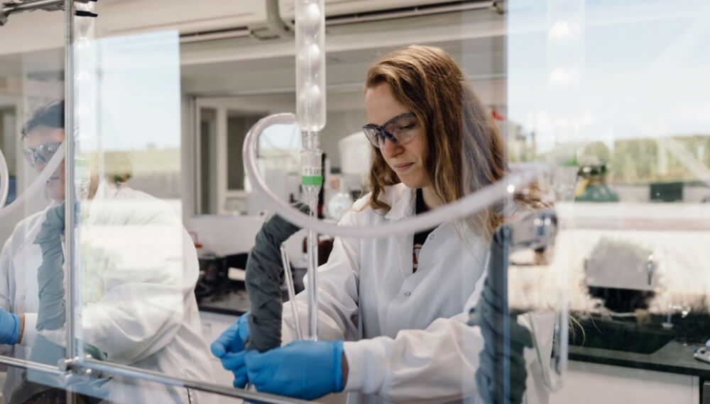 Woman wearing a lab coat working in a laboratory